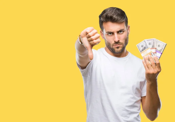 Jovem Homem Bonito Segurando Pilha Dólares Sobre Fundo Isolado Com — Fotografia de Stock