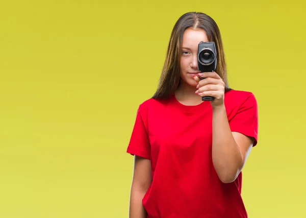 Young Beautiful Caucasian Woman Filming Using Vintage Video Camera Isolated — Stock Photo, Image