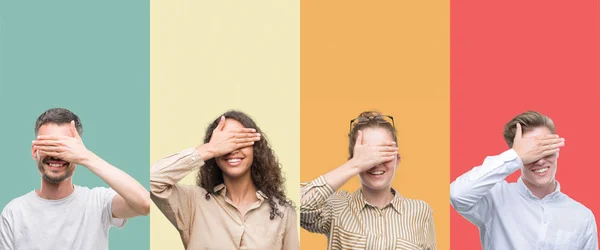 Collage of a group of people isolated over colorful background smiling and laughing with hand on face covering eyes for surprise. Blind concept.