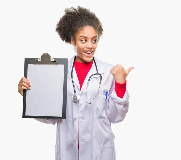 Young Afro American Doctor Woman Holding Clipboard Isolated Background Pointing — Stock Photo, Image