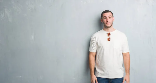 Young Caucasian Man Grey Grunge Wall Wearing Sunglasses Depressed Worry — Stock Photo, Image