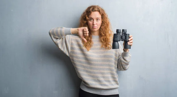 Young Redhead Woman Grey Grunge Wall Looking Binoculars Angry Face — Stock Photo, Image