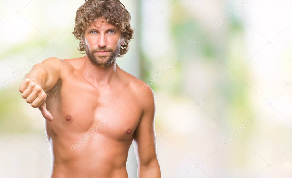 Handsome hispanic model man sexy and shirtless over isolated background looking unhappy and angry showing rejection and negative with thumbs down gesture. Bad expression.