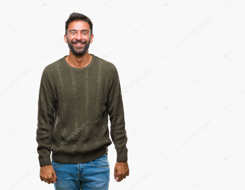 Adult hispanic man wearing winter sweater over isolated background with a happy and cool smile on face. Lucky person.