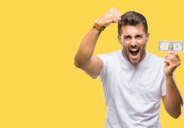 Yakışıklı delikanlı holding dolar izole rahatsız ve hayal kırıklığına uğramış öfke kavramı ile öfke, çılgın ve yükseltilmiş eliyle diye bağıran bağırarak arka plan