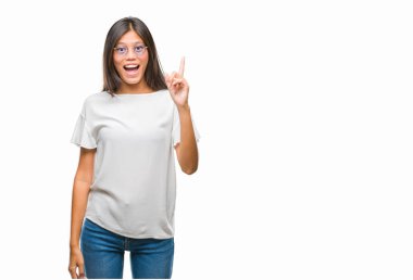 Genç Asyalı kadın işaret parmağını başarılı fikir