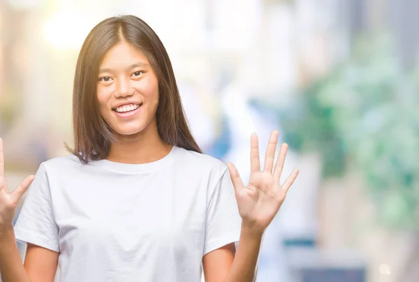 Young Asian Woman Isolated Background Showing Pointing Fingers Number Ten — Stock Photo, Image