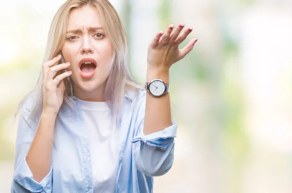 Young Blonde Woman Talking Using Smarpthone Isolated Background Annoyed Frustrated — Stock Photo, Image