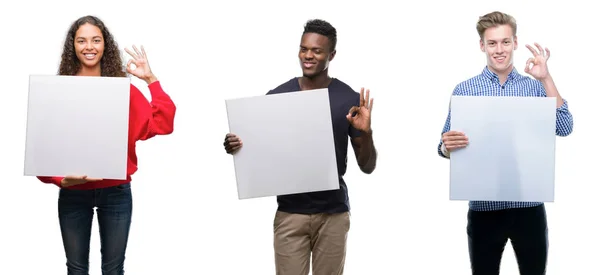Composition Young People Holding Blank Banner Isolated Background Doing Sign — Stock Photo, Image