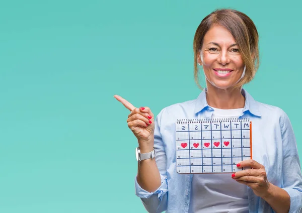 Mulher Hispânica Sênior Meia Idade Segurando Calendário Menstruação Sobre Fundo — Fotografia de Stock