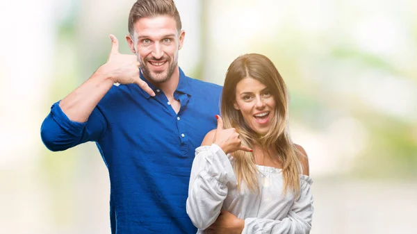 Young Couple Love Isolated Background Smiling Doing Phone Gesture Hand — Stock Photo, Image