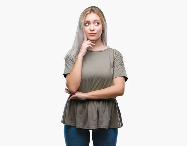 Young Blonde Woman Isolated Background Hand Chin Thinking Question Pensive — Stock Photo, Image