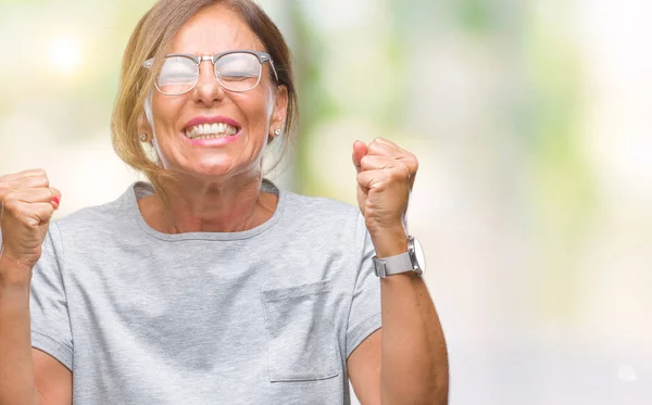 Middelbare Leeftijd Senior Spaanse Vrouw Bril Geïsoleerd Achtergrond Vieren Gekke — Stockfoto