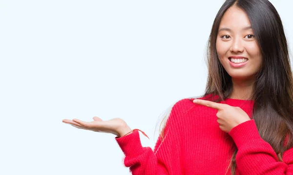 Young Asian Woman Holding Something Hand Pointing Finger — Stock Photo, Image