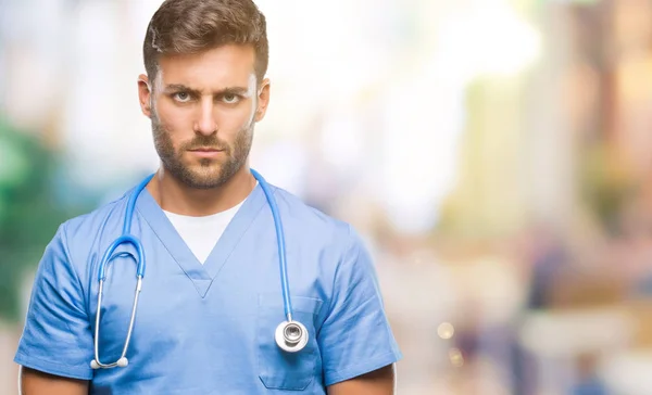 Young Handsome Doctor Nurse Man Isolated Background Skeptic Nervous Frowning — Stock Photo, Image