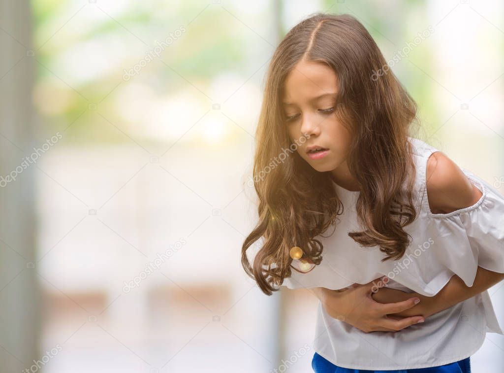 Brunette hispanic girl with hand on stomach because indigestion, painful illness feeling unwell. Ache concept.