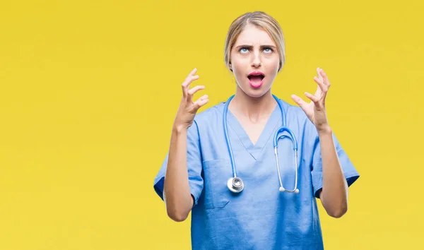 Young Beautiful Blonde Doctor Surgeon Nurse Woman Isolated Background Crazy — Stock Photo, Image