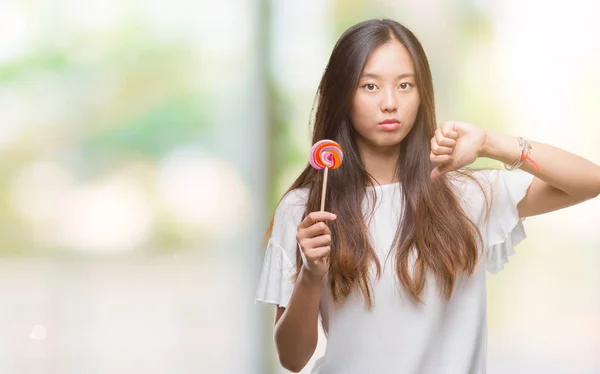 Young Asian Woman Eating Lollipop Candy Isolated Background — Stock Photo, Image