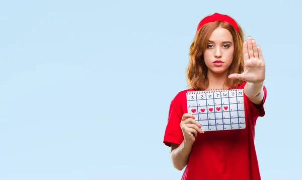 Mooie Jongedame Geïsoleerde Achtergrond Houden Menstruatie Kalender Met Open Hand — Stockfoto