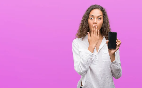 Young Hispanic Woman Using Smartphone Cover Mouth Hand Shocked Shame — Stock Photo, Image