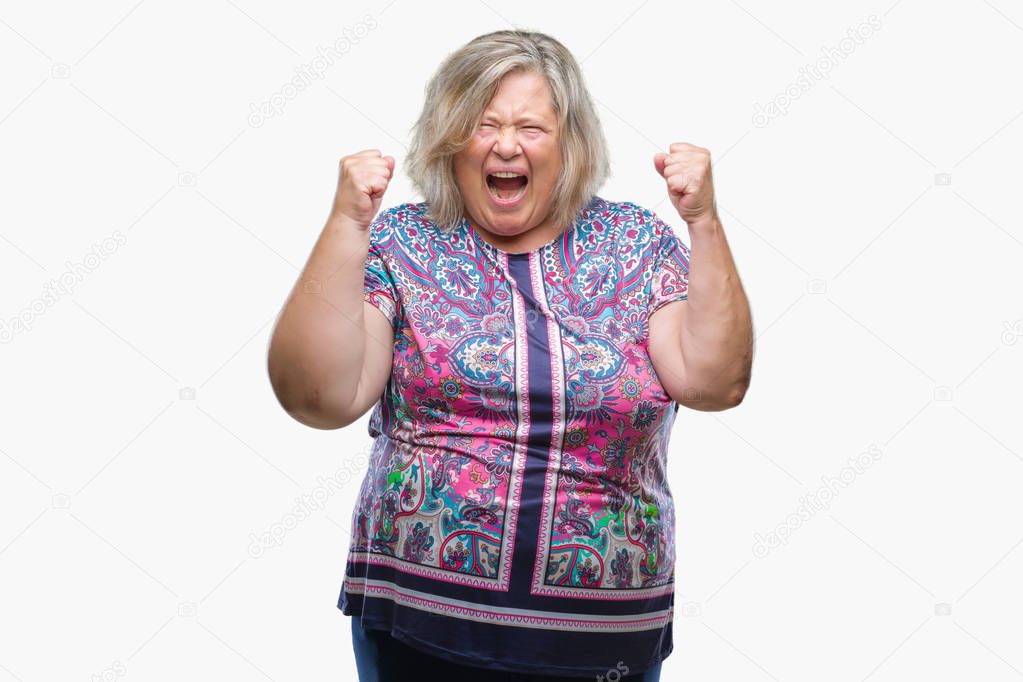 Senior plus size caucasian woman over isolated background crazy and mad shouting and yelling with aggressive expression and arms raised. Frustration concept.