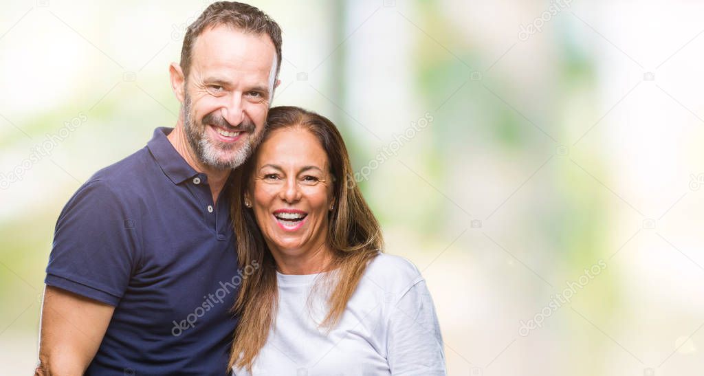 Middle age hispanic casual couple over isolated background with a happy and cool smile on face. Lucky person.