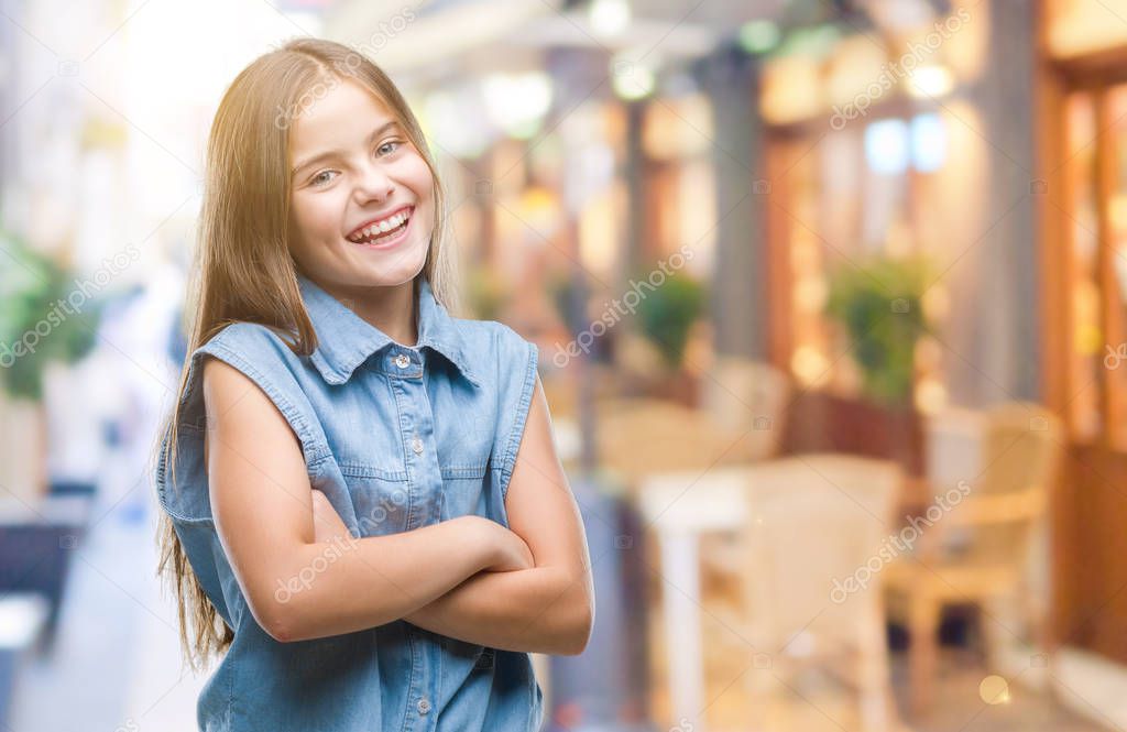 Young beautiful girl over isolated background happy face smiling with crossed arms looking at the camera. Positive person.