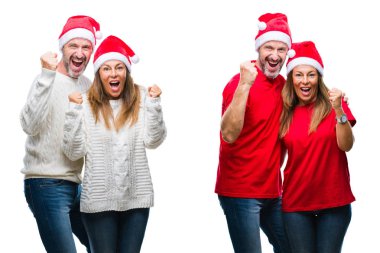 Kolaj orta yaş olgun güzel çift izole arka plan kutlama şaşırttı ve başarı için kaldırdı kollarını açarak hayran beyaz üzerinde Noel şapka ve gözleri açık. Kazanan kavramı.