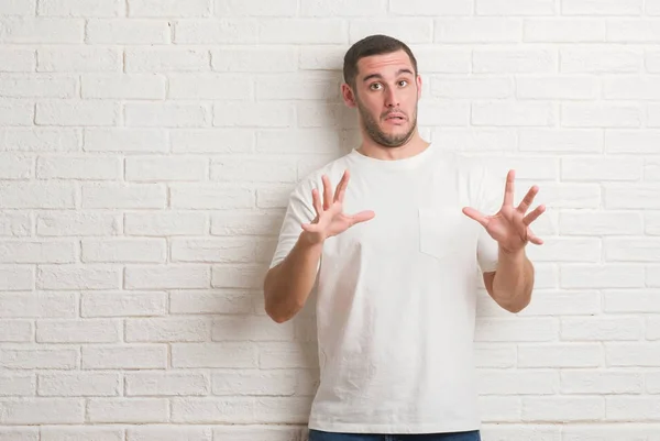 Young Caucasian Man Standing White Brick Wall Shouting Crazy Expression — Stock Photo, Image