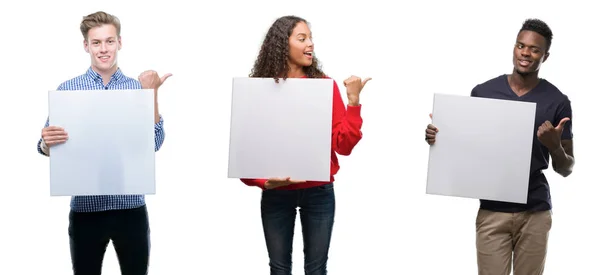 Composition Young People Holding Blank Banner Isolated Background Pointing Showing — Stock Photo, Image