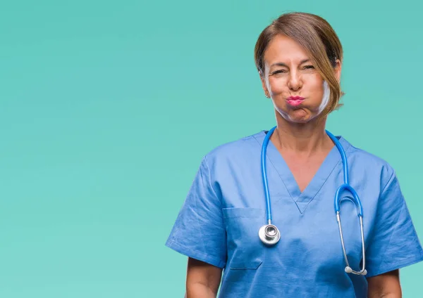 Enfermera Médica Mediana Edad Sobre Fondo Aislado Hinchando Mejillas Con — Foto de Stock