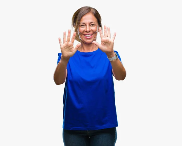 中年资深西班牙裔妇女在孤立的背景显示和指向手指数十 而微笑着自信和快乐 — 图库照片