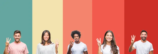 不同的种族年轻人拼贴在五颜六色的条纹孤立的背景显示和指向与手指数字三 同时微笑着自信和快乐 — 图库照片