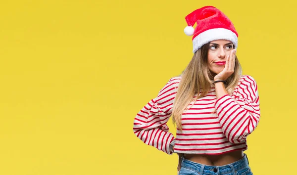 疲れていて 組んだ腕のうつ病問題にうんざりして孤立した背景を考えての上のクリスマスの帽子をかぶって若い美しい女性 — ストック写真