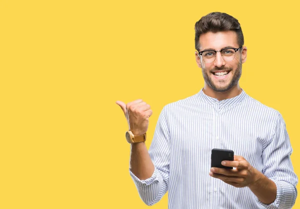 Young Handsome Man Texting Using Smartphone Isolated Background Pointing Showing — Stock Photo, Image