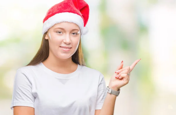 Mooie Kaukasische Jongedame Kerstmuts Dragen Geïsoleerde Achtergrond Met Een Grote — Stockfoto