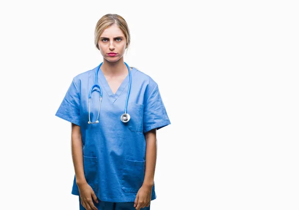 Young Beautiful Blonde Doctor Surgeon Nurse Woman Isolated Background Skeptic — Stock Photo, Image