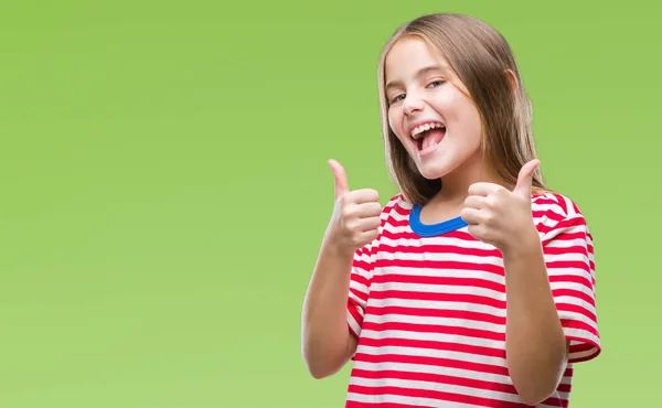 Young beautiful girl over isolated background success sign doing positive gesture with hand, thumbs up smiling and happy. Looking at the camera with cheerful expression, winner gesture.