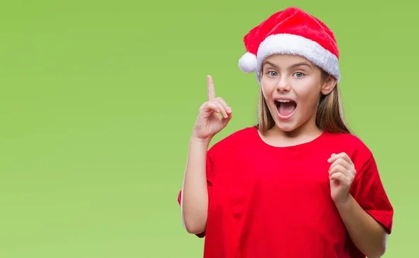 年轻美丽的女孩戴着圣诞节帽子在孤立的背景指向手指与成功的想法 退出和快乐 第一个 — 图库照片
