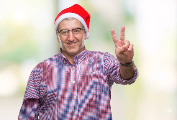 Gutaussehender Älterer Herr Mit Weihnachtsmütze Vor Isoliertem Hintergrund Lächelnd Mit — Stockfoto