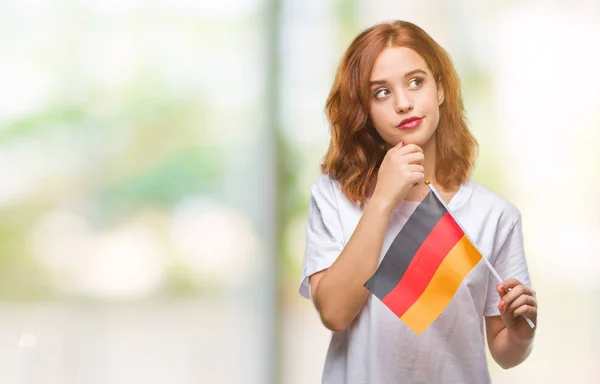 Joven Hermosa Mujer Sosteniendo Bandera Alemania Sobre Fondo Aislado Cara —  Fotos de Stock