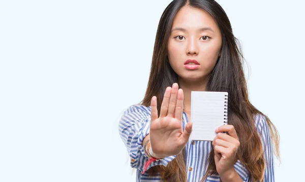 Young Asian Woman Holding Notebook Isolated Background Open Hand Doing — Stock Photo, Image