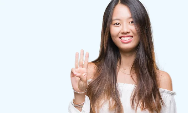 年轻的亚洲妇女在孤立的背景显示和指向手指数三 而微笑着自信和快乐 — 图库照片