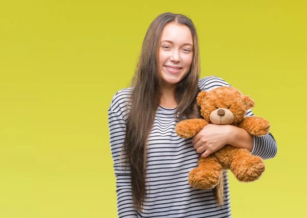Junge Kaukasische Frau Hält Teddybär Über Isoliertem Hintergrund Mit Einem — Stockfoto