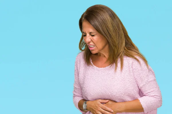 Beautiful middle age adult woman wearing winter sweater over isolated background with hand on stomach because indigestion, painful illness feeling unwell. Ache concept.