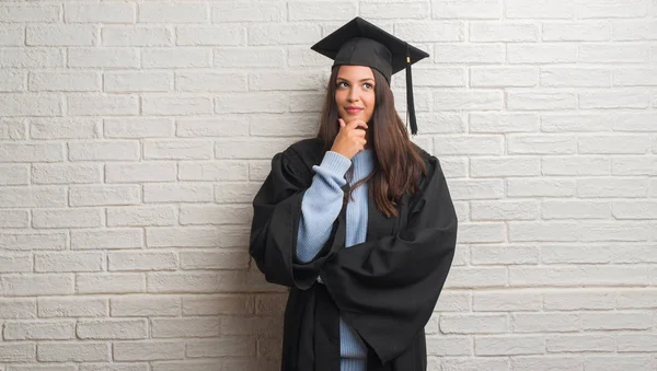 Young Brunette Woman Standing White Brick Wall Wearing Graduate Uniform — Stock Photo, Image