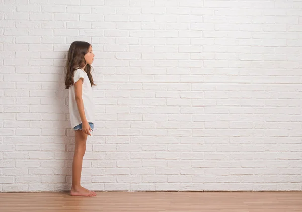 Young Hispanic Kid Stading White Brick Wall Looking Side Relax — Stock Photo, Image