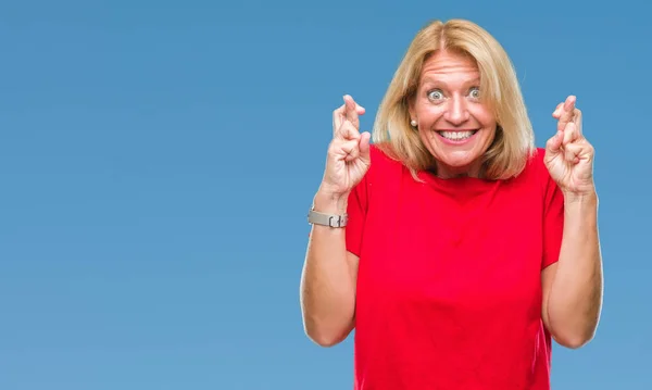 Middle Age Blonde Woman Isolated Background Smiling Crossing Fingers Hope — Stock Photo, Image