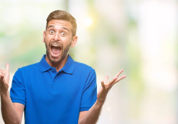 Young Handsome Man Isolated Background Celebrating Crazy Amazed Success Arms — Stock Photo, Image