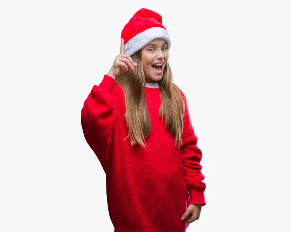 Menina Bonita Nova Vestindo Chapéu Natal Sobre Fundo Isolado Apontando — Fotografia de Stock